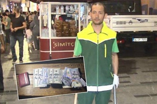Zibil yığırdı, dollarla dolu pul qabı tapdı